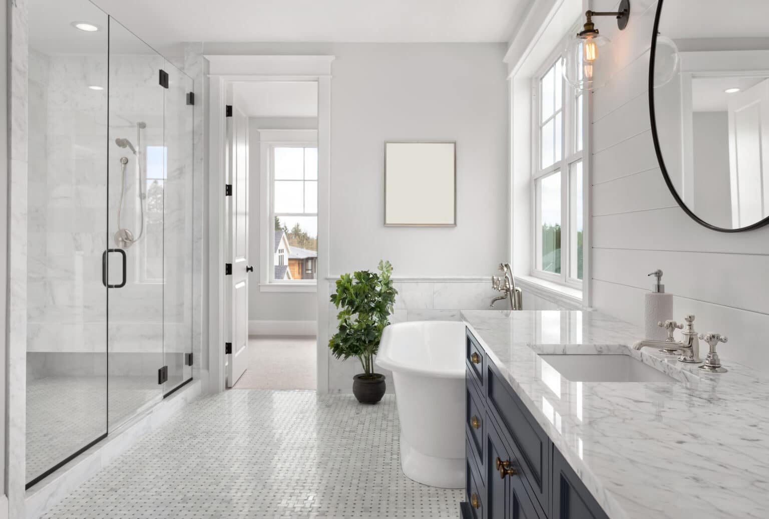 Beautiful Ensuite Master Bathroom in New Luxury Home. Features Elegant Countertop, Bathtub, Shower, and Walk-in Closet